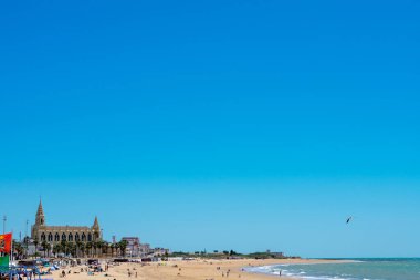 Chipiona beach in the province of Cadiz. In the background: Sanctuary of the Virgin of Regla de Chipiona, Cadiz. Andalusia. Spain. Europe.