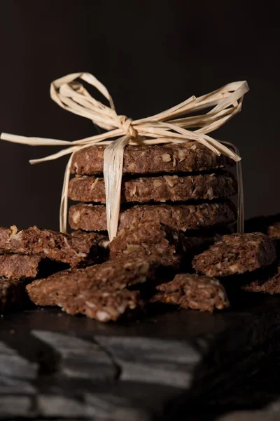 Pack of cereal biscuits on piece of black stone — Stock Photo, Image