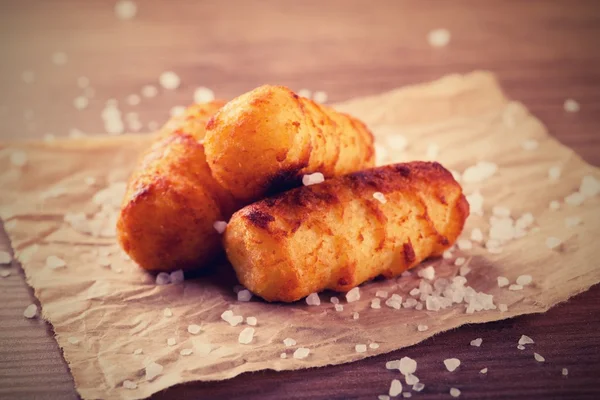 Retro-Foto von gebratenen Kartoffelkroketten — Stockfoto