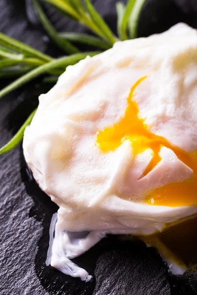 Detail of single poached egg on slate stone — Stock Photo, Image