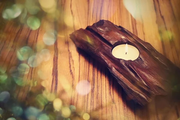 Candle in wooden holder — Stock Photo, Image