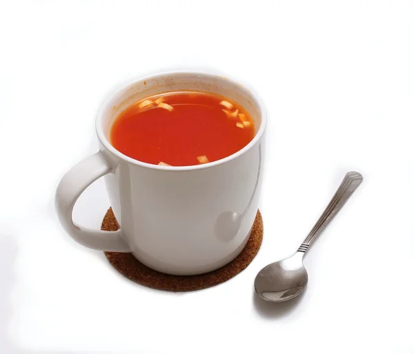 Tomato soup and spoon Stock Image