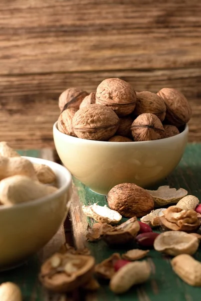 Yellow bowl with heap of walnuts — Stock Photo, Image