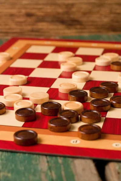 Wooden stones on board for Game of Checkers — Stock Photo, Image