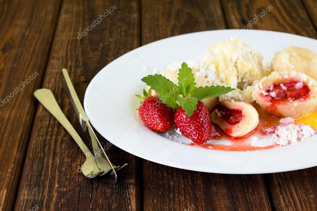 Strawberry dumplings on white plate
