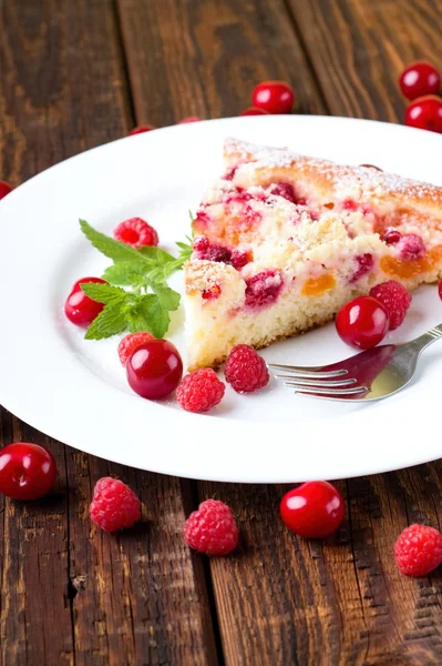 Fruit pie on white plate with berries — Stock Photo, Image