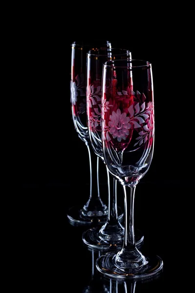 Three glasses with red ornament — Stock Photo, Image