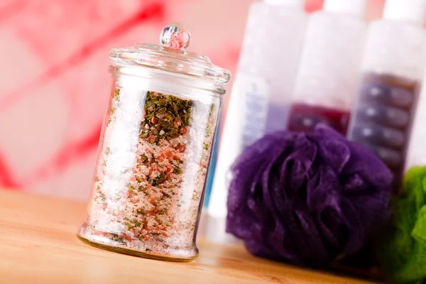 Jar with bath salt askew placed on wooden board — Stock Photo, Image