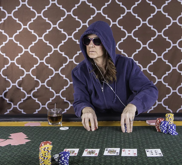 A woman playing poker at a table