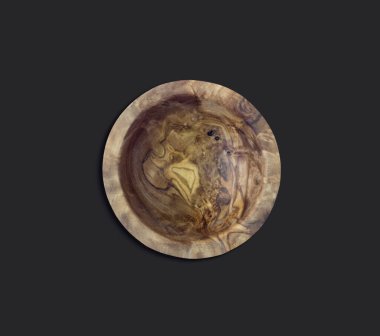 Top up view of olive wooden bowl on black background with flat lay style. fit for your design element.