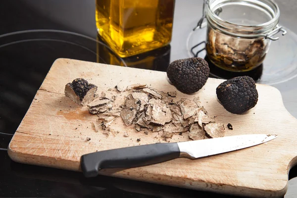Black Truffles on wooden board Royalty Free Stock Images