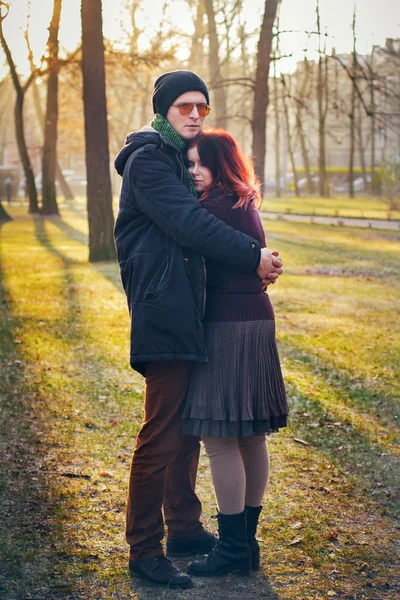 Young couple in love walking in the autumn park — Stock Photo, Image