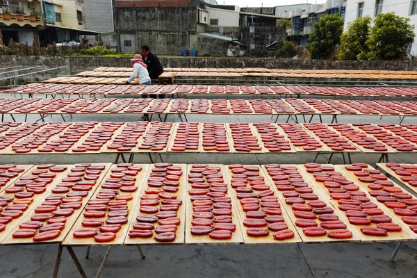 Beigang, Taiwan, January, 9th, 2014, Workers sort drying grey m — стоковое фото