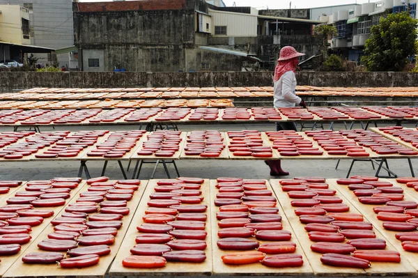 Beigang, Taiwan, January, 9th, 2014, Workers sort drying grey m — стоковое фото