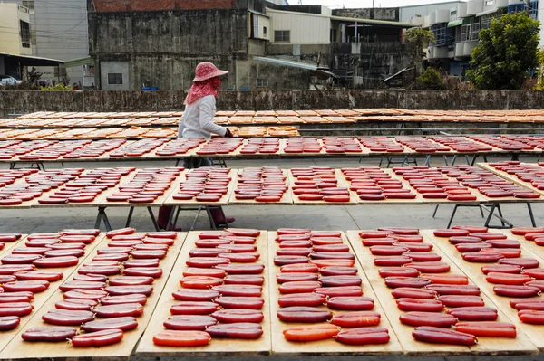 Beigang, Taiwan, January, 9th, 2014, Workers sort drying grey m — стоковое фото