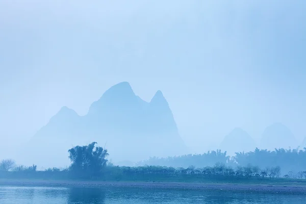 Li River scenery sight with fog in spring — Stock Photo, Image