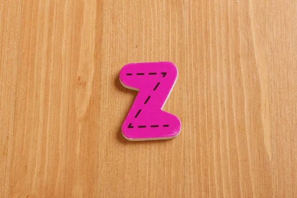 Z,spell by woody puzzle letters with woody background — Stock Photo, Image