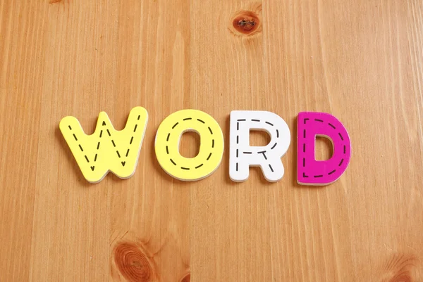 Word, spell av woody pussel bokstäver woody bakgrund — Stockfoto