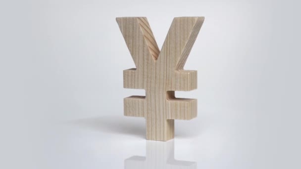 Rotazione simbolo yen in legno su sfondo bianco — Video Stock