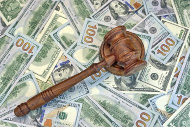 Judges Or Auctioneer Gavel On The Dollar Cash Background clipart