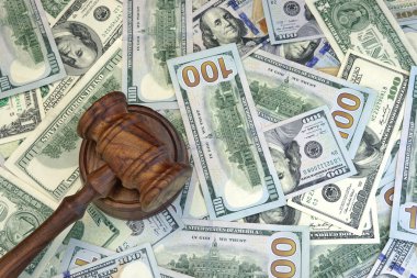 Judges Or Auctioneer Gavel On The Dollar Cash Background clipart