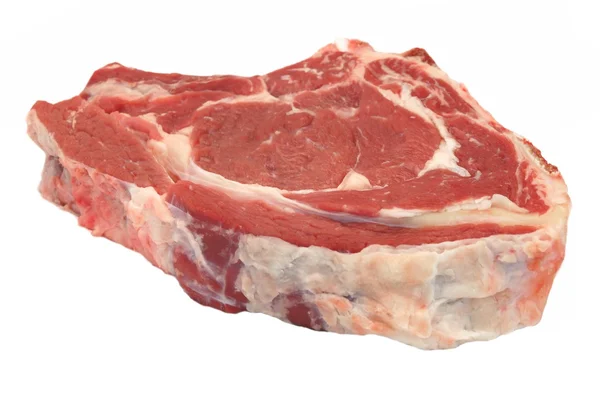 Single surowe wołowiny Ribeye Steak izolowane na białym, napowietrznych, Closeu — Zdjęcie stockowe
