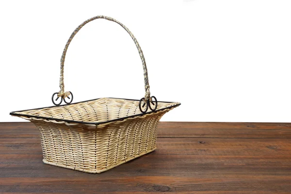 Empty Vintage Wicker Basket Metal Handle Brown Wooden Table Isolated — Stock Photo, Image