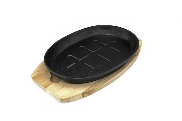 Żeliwo obsługujących Griddles Pan na drewno płyta biały izolowane — Zdjęcie stockowe
