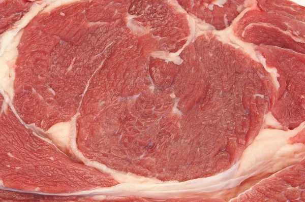 Bife de carne cru texturizado fundo — Fotografia de Stock