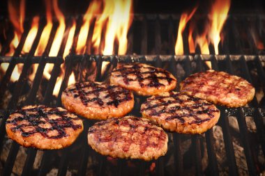 BBQ Grilled Burgers Patties On The Hot Flaming Grill clipart