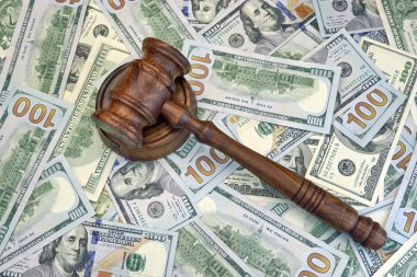 Judges Or Auctioneer Gavel On The Dollar Cash Background clipart