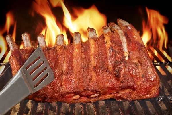 Pork Baby Back Or Spareribs On BBQ Grill With Flames — Stock Photo, Image
