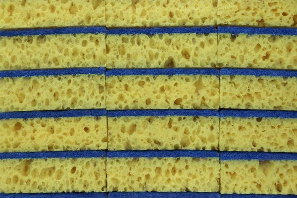 New Absorbent Yellow Sponge background — стоковое фото