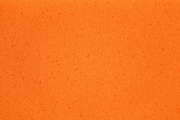 Gąbka pomarańczowa powierzchnia streszczenie tło — Zdjęcie stockowe