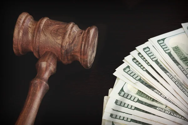 Auctioneers Hammer or Gavel With Money Heap On Black Background — Stock Photo, Image