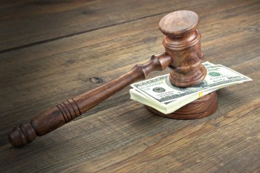 Judges or Auctioneer Gavel, Soundboard And Bundle Of Dollar Cash On The Rough Wooden Textured Table Background. Concept For Corruption, Bankruptcy Court, Bail, Crime, Bribing, Fraud, Auction Bidding. clipart