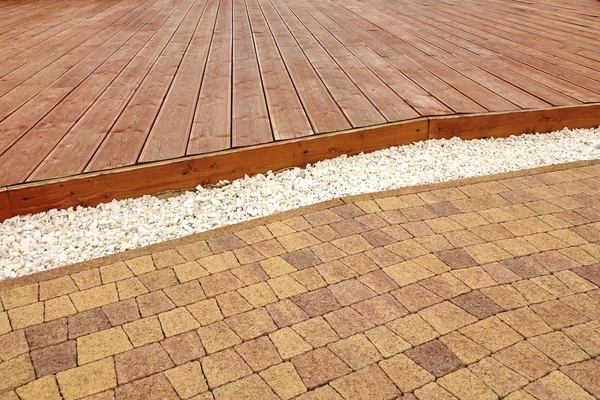 Composite Wood Decking, White Marble Gravel And Stone Brick Pavi — Stock Image Composite Wood Decking, White Marble Gravel And Stone Brick Pavi Stock Image
