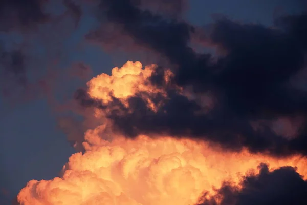 Dramatic Orange Sunset. Colorful Clouds Background. Low Angel View Of Dramatic Clouds Formations.