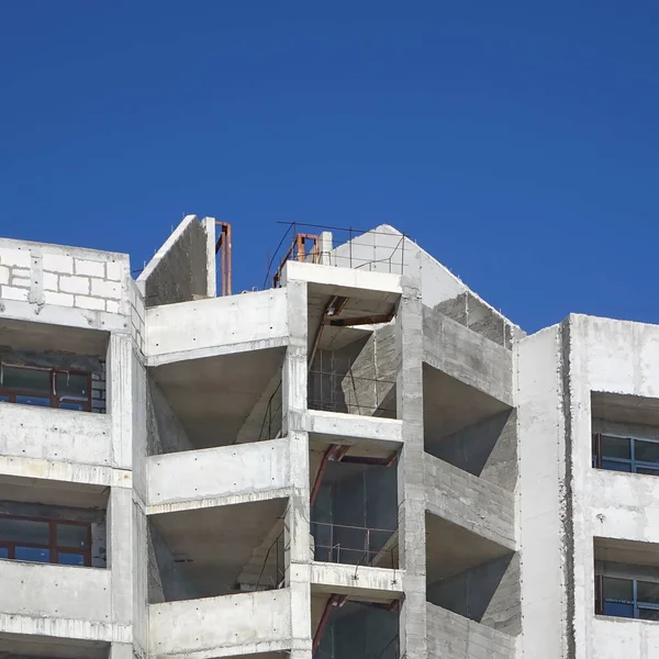 Unfinished Construction Of Monolithic House.  Construction Of Monolithic Multistory Building. Site Work From Concrete Apartments Building Framework.