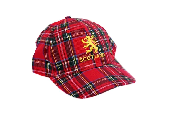 Red tartan cap with scottish arms — Stock Photo, Image