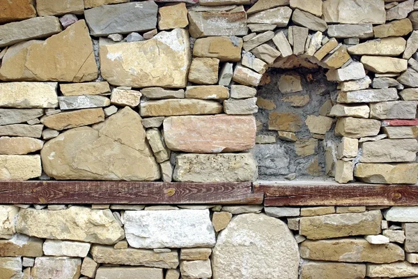 Alte Steinmauer mit Nische — Stockfoto