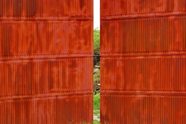 Rusty corrugated metal red wall and gate — Stock Photo, Image