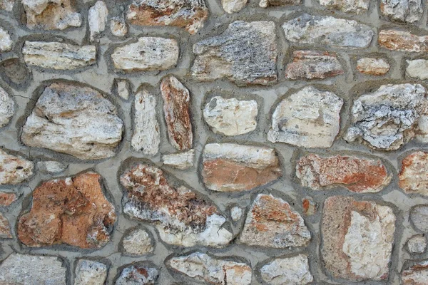 Pared de piedra con patrón de azulejos aleatorios —  Fotos de Stock