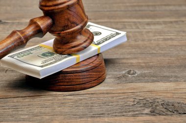 Wad of Money and Judges Gavel clipart