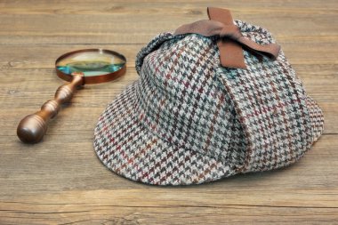 Deerstalker Hat and Retro Magnifying Glass clipart