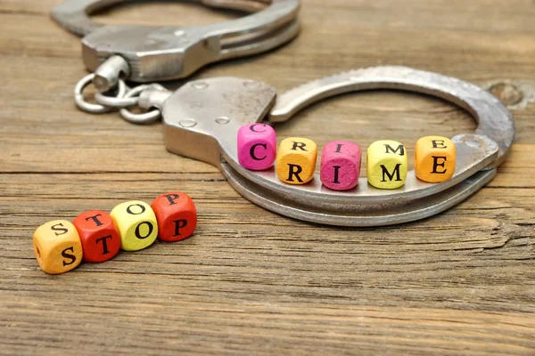 Sign Stop Crime and Handcuffs — Stock Photo, Image