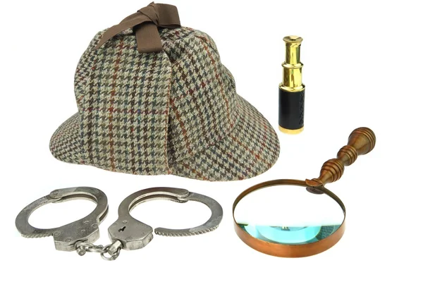 Deerstalker Hat, Magnifier, Handcuffs and Spyglass — Zdjęcie stockowe