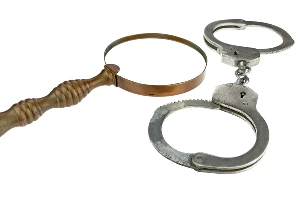 Retro Magnifying Glass and Handcuffs — Stock Photo, Image