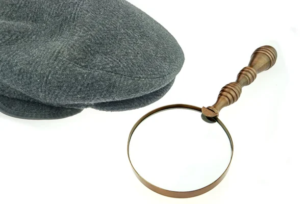 Warme Kappe mit Ohrenklappen und Lupe — Stockfoto