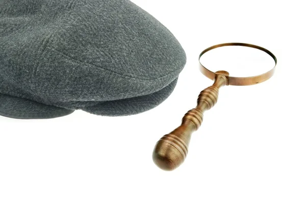 Warm Cap with Earflaps and Magnifying Glass — Stock Photo, Image